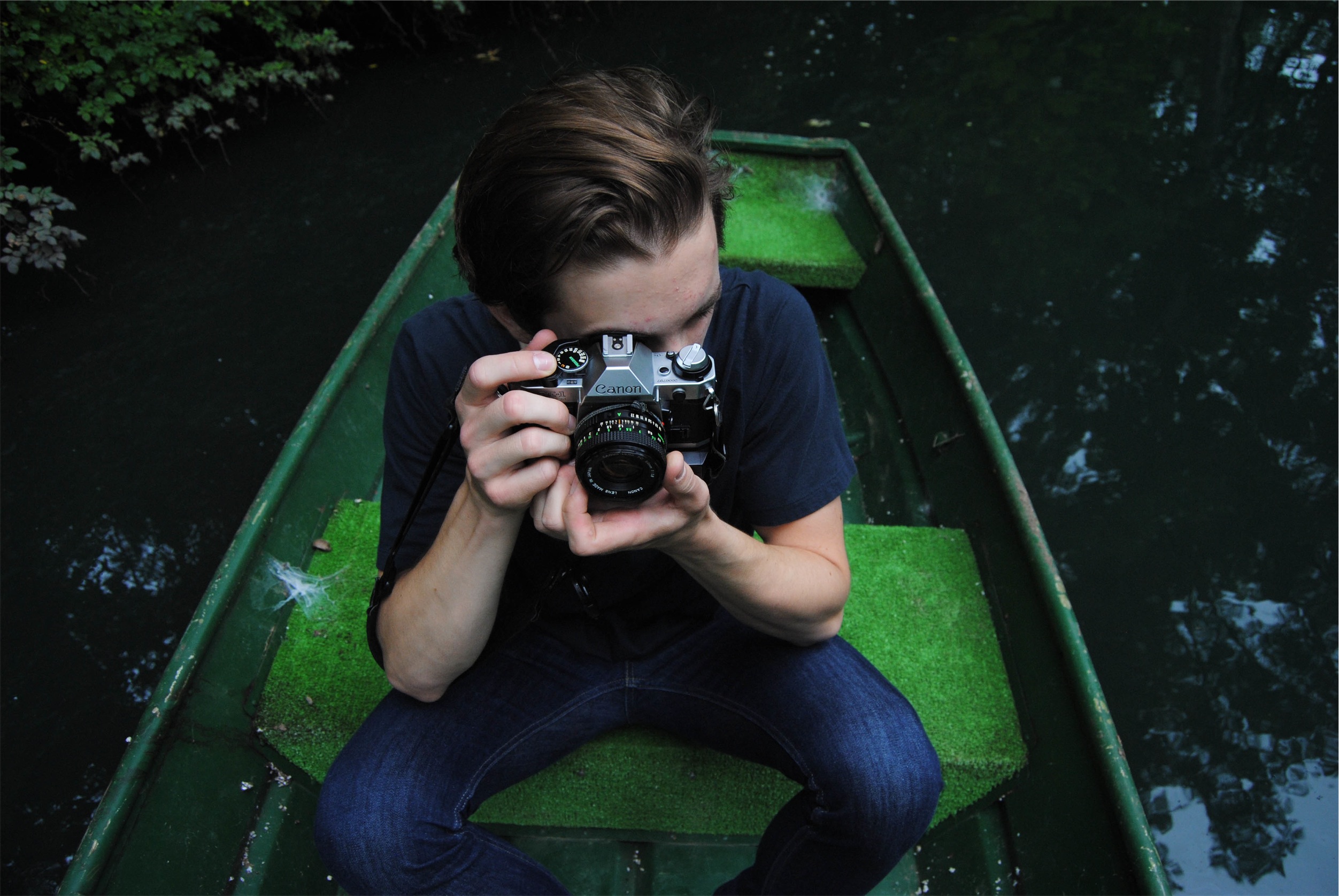 Taking pictures in a canoe